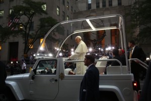 Pope Francis rides by crowds outside of St. Patrick's Cathedral in New York. Credit: Damon Winter/The New York Times/Pool/Reuters