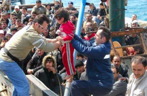 Refugees crammed onto a dinghy.