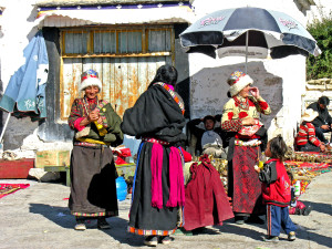 People dressed in traditional clothes selling things to visitors in Lhasa, TIbet. https://flic.kr/p/53aLZN