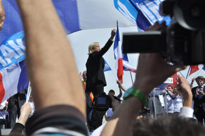 Le Pen waves to a crowd of supporters at a meeting of the FN. https://flic.kr/p/ciN3J5