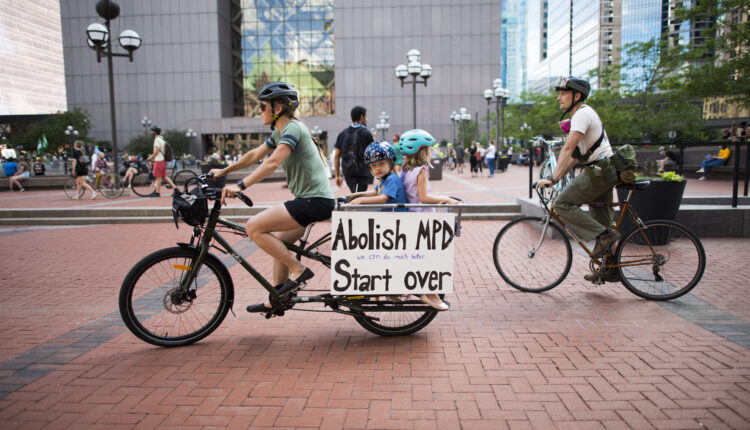 A family biking to a BLM protest