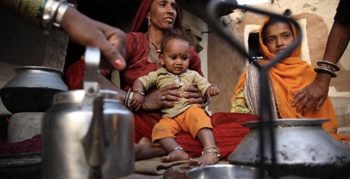 Tulsi Devi, the wife of a farmer, prepares tea at her home in Nagar Village, Rajasthan, India
